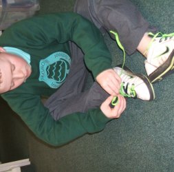 Robert learns to tie his laces!