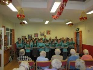 Singing carols at Rectory Field