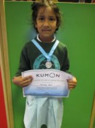 Anya Received a medal and a certificate for her brilliant Kumon work.